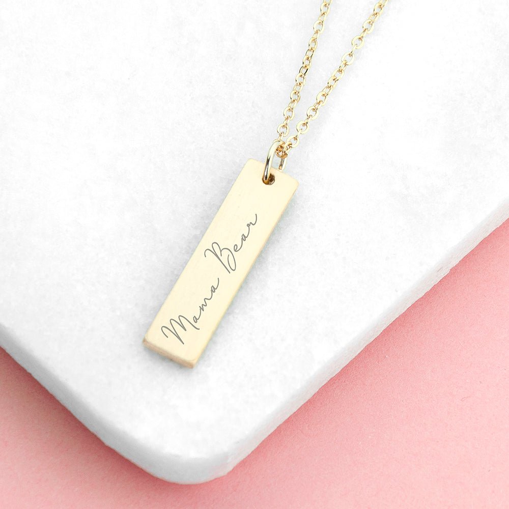 Gold bar pendant necklace engraved with a loved one's handwriting. A sentimental, stylish gift. Length: 3cm.