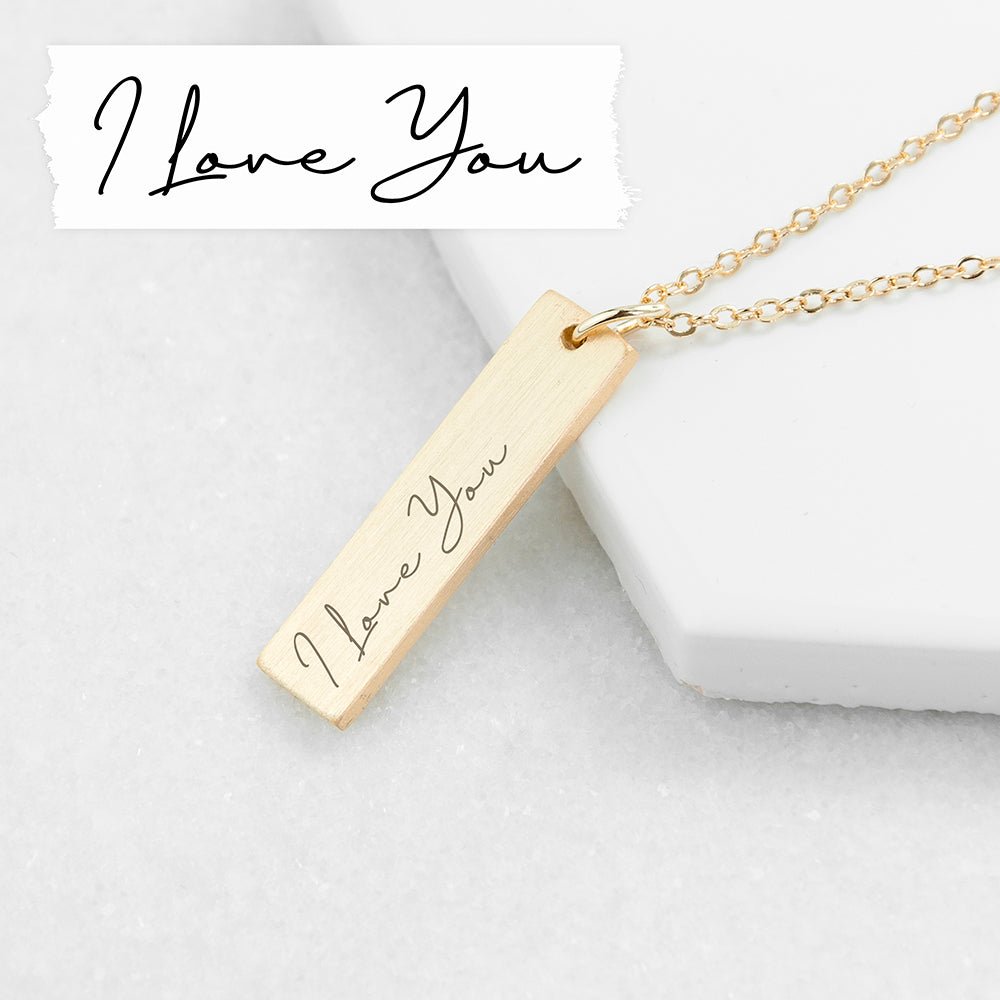 Gold bar pendant necklace engraved with a loved one's handwriting. A sentimental, stylish gift. Length: 3cm.