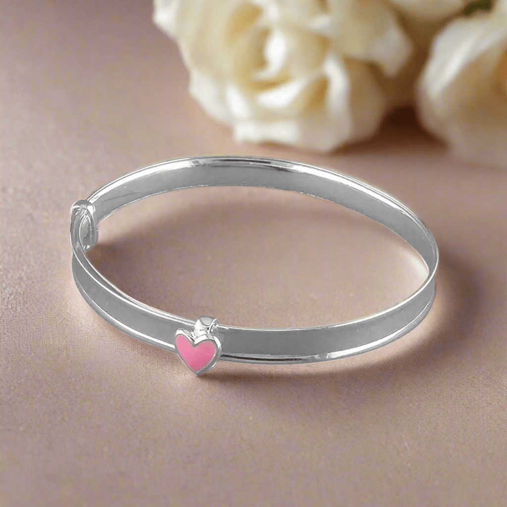 Sterling silver baby bangle with enamel daisy, heart, or crown. Expandable, engravable, perfect keepsake.